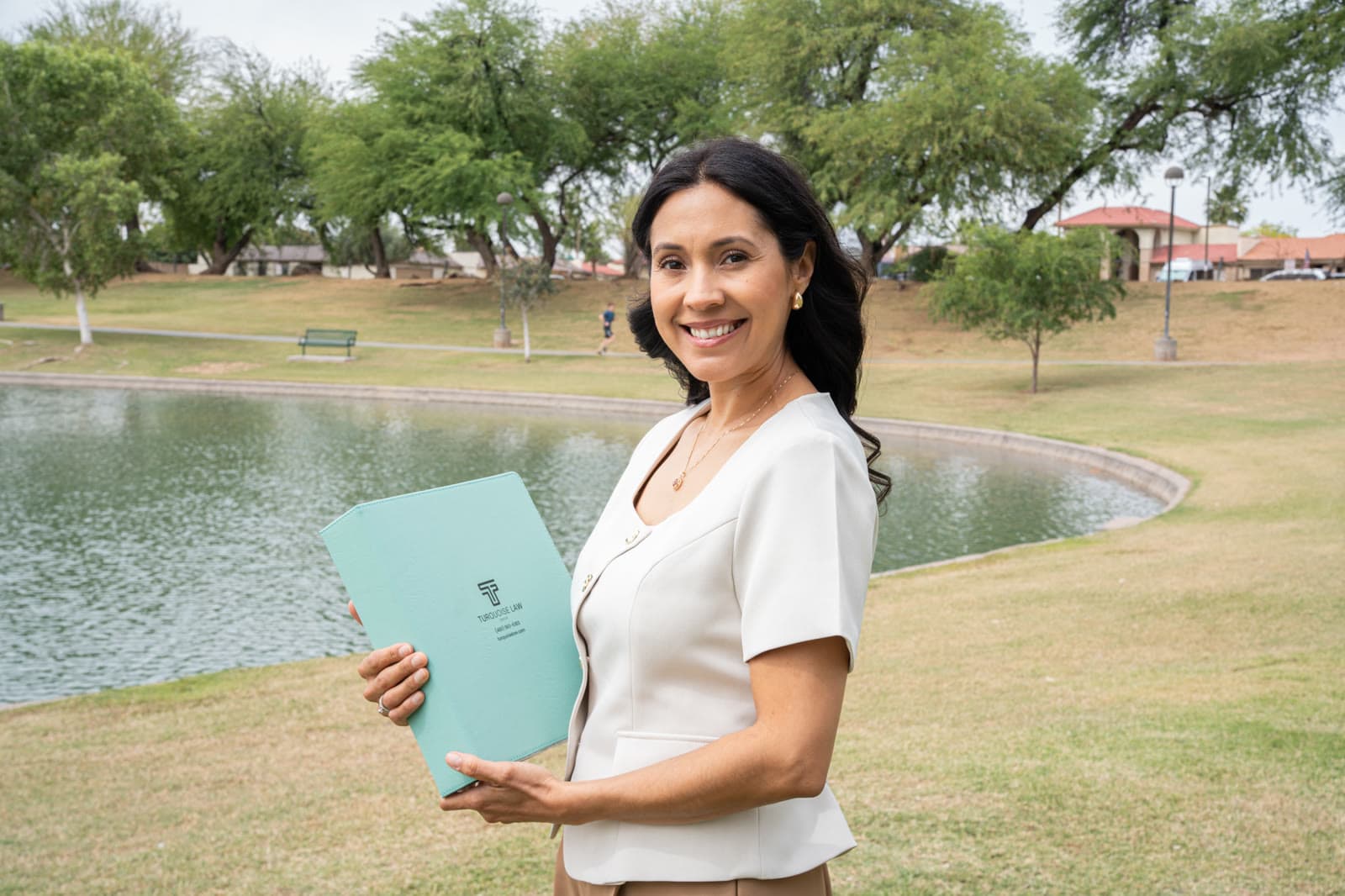 A Turquoise Law Group trust folder handed to a trustee